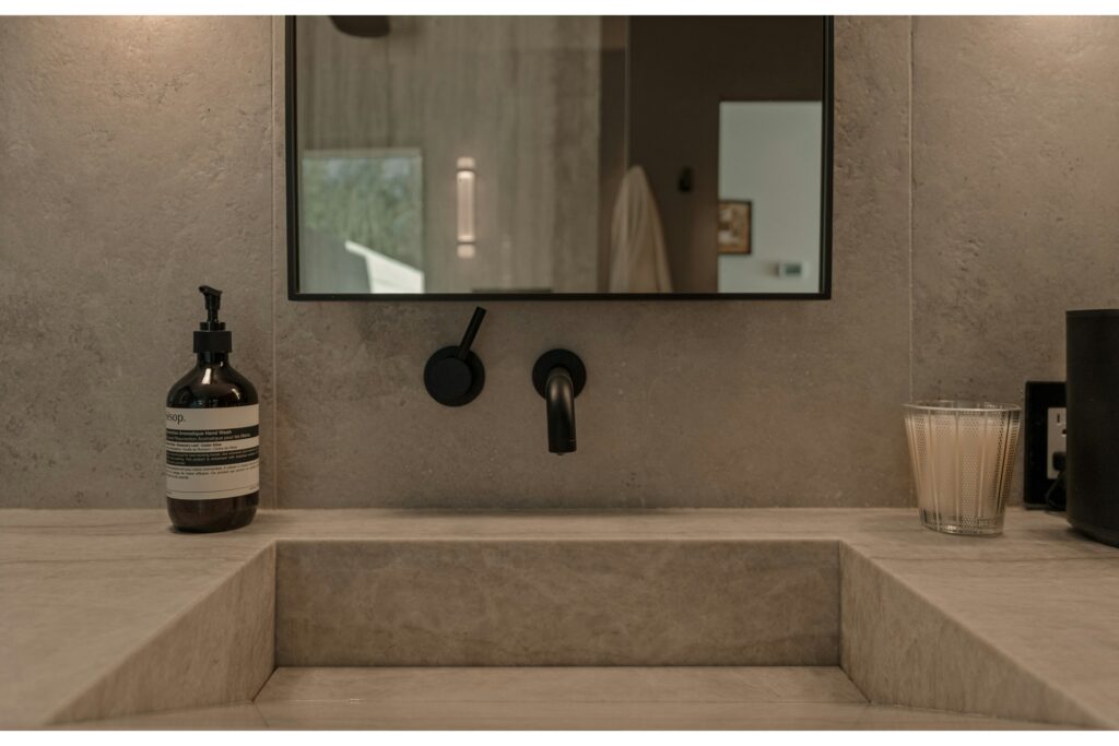 Wall-mounted faucets open up more space on bathroom counters.