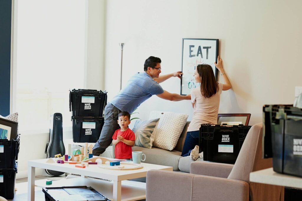 a family decorating the living after moving