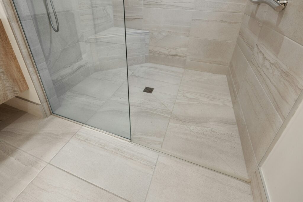 A curb-free bathroom creates a consistent surface, reducing the risk of slips and falls.