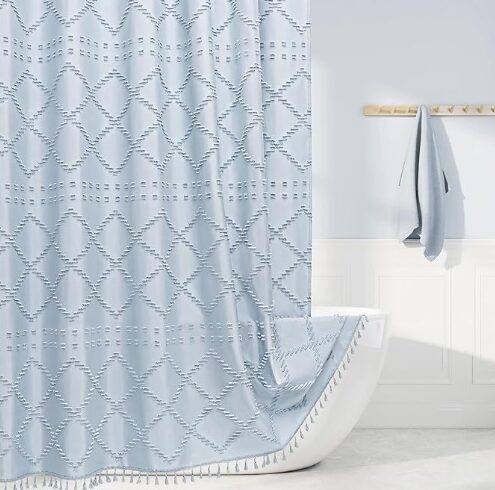 Give your bathroom a spring makeover with this gorgeous tasseled shower curtain.