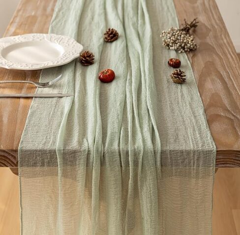 Choose a sage green table runner for elegant draping.