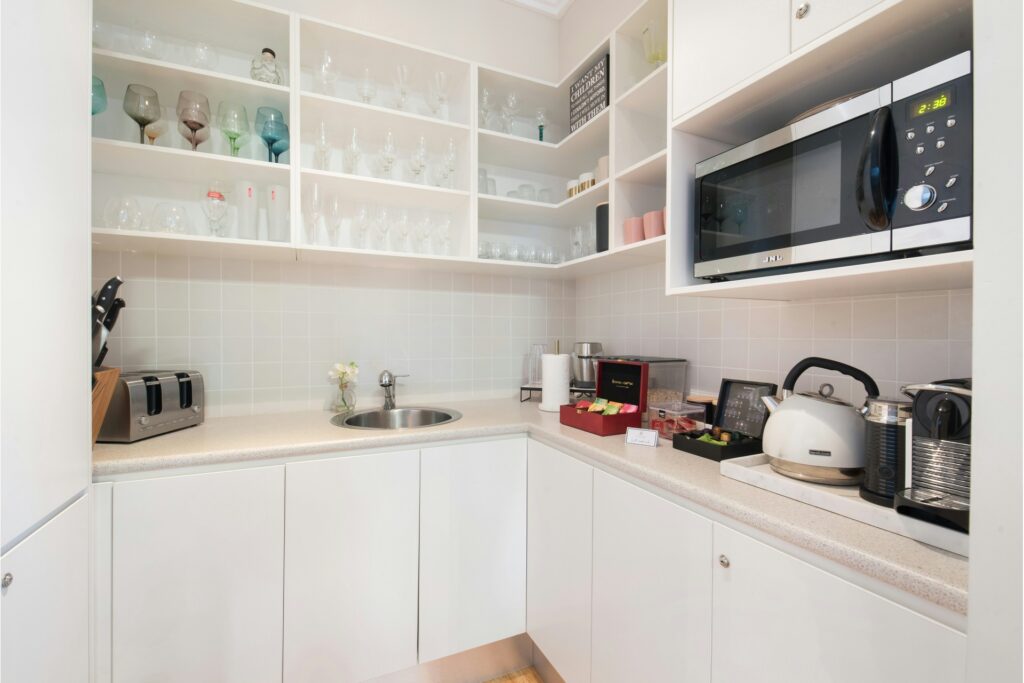 A modern butler’s pantry is a hardworking, multifunctional space that supports the main kitchen.